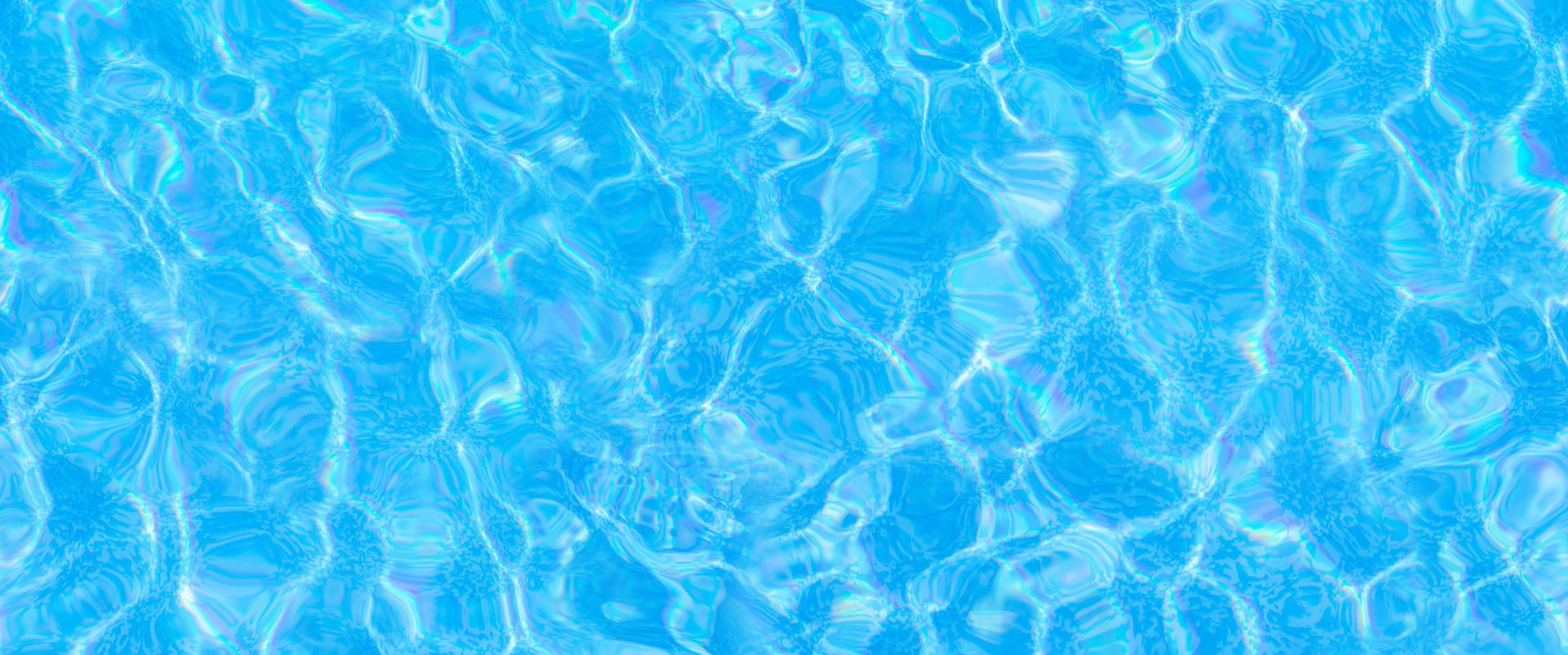 Iridescent ripples of a bright blue and pink liquid